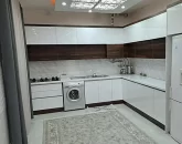 کابینت های سفید و لباسشویی آشپزخانه ویلا در جویبار