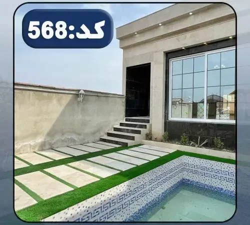 نمای سنگی نورپردازی شده با نور سفید و محوطه سنگ فرش شده ویلا در جویبار