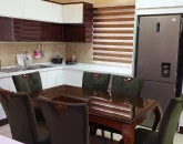 آشپزخانه با میز غذاخوری 6 نفره و یخچال ویلا در ساری 38463473