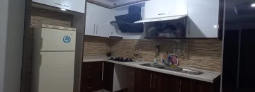آشپزخانه با کابینت های ام دی اف با کیفیت و باکس یخچال و هود و گاز صفحه ای در آپارتمان 195 متری در قائمشهر 015814864163