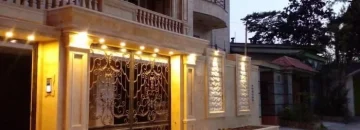 نمای سنگ کاری شده و نورپردازی شیک آپارتمان 125 متری در خزرآباد 15648168769